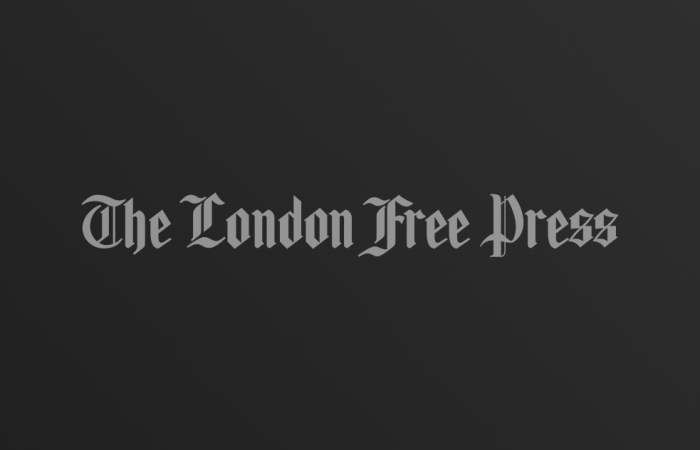 The London Free Press logo on dark gradient background