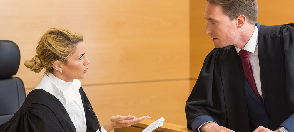 Lawyer speaking with the judge in the court room